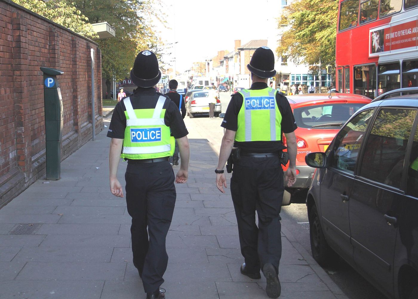 Officers on patrol in a town centre. The smallest force in England has 1,100 officers; the largest has 34,000.