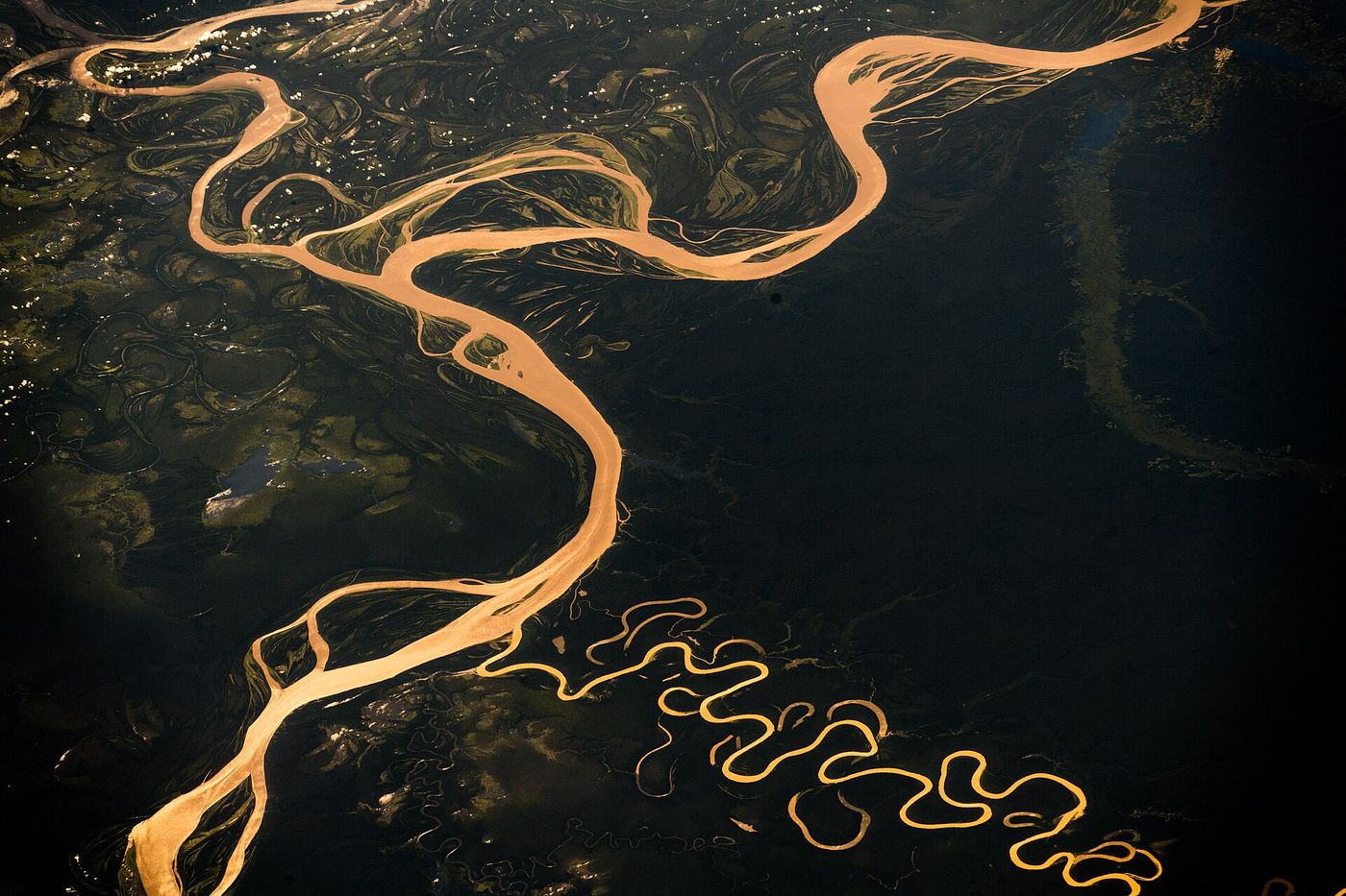 Boats stranded on the dry bank of a river in the Brazilian Amazon.
