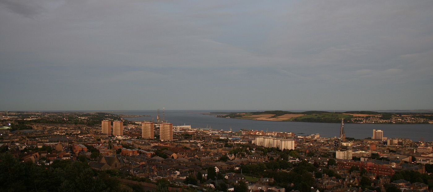 Dundee from the Law; the school sits on a former mill site in Lochee, west of the city centre.