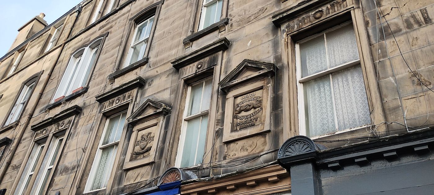 A street of stone tenements in Edinburgh.